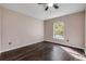 Cozy bedroom with wood floors and a bright window, perfect for relaxation and rest at 524 Quail View Ct, Debary, FL 32713