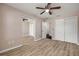 Spacious bedroom featuring wood floors, two closets, and easy access to other rooms at 524 Quail View Ct, Debary, FL 32713