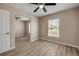 Well-lit bedroom boasting wood flooring and natural light, creating a warm and inviting ambiance at 524 Quail View Ct, Debary, FL 32713