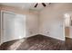 Neutral bedroom featuring hardwood floors, ceiling fan, closet and neutral paint at 524 Quail View Ct, Debary, FL 32713