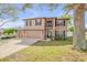 Charming home featuring a three-car garage, well-maintained lawn, and mature trees in a desirable neighborhood at 524 Quail View Ct, Debary, FL 32713