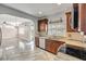 View of the kitchen showcasing stainless steel appliances and granite countertops at 524 Quail View Ct, Debary, FL 32713