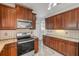 Kitchen featuring stainless steel appliances, granite countertops, and tile backsplash at 524 Quail View Ct, Debary, FL 32713