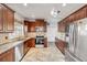 Well-lit kitchen features stainless steel appliances, granite countertops, and ample cabinet space at 524 Quail View Ct, Debary, FL 32713