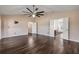 Spacious living room showcasing hardwood floors with doorway to an adjacent room at 524 Quail View Ct, Debary, FL 32713