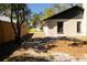 Side view of home with grass yard, partial fencing and landscaping at 5443 Aeolus Way, Orlando, FL 32808