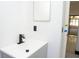 Bathroom featuring sleek matte black faucet and a vessel sink with modern vanity at 5443 Aeolus Way, Orlando, FL 32808