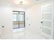 Modern living room with an open floor plan and glass sliding doors to the outdoors at 5443 Aeolus Way, Orlando, FL 32808