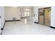 Open living area with marble floors and recessed lighting fixtures throughout at 5443 Aeolus Way, Orlando, FL 32808