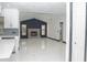 Open-concept living area featuring a sleek fireplace, lots of light, and polished marble floors at 5443 Aeolus Way, Orlando, FL 32808