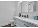 Bright bathroom featuring a modern vanity with storage, sleek fixtures, and a clean, minimalist design at 599 Glendevon Dr, New Smyrna Beach, FL 32168