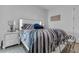 Bedroom features a zebra patterned bed set, side tables, and modern decor at 599 Glendevon Dr, New Smyrna Beach, FL 32168