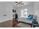 Stylish bedroom with dark wood floors, mini-bar, and access to pool area, creating a private retreat at 599 Glendevon Dr, New Smyrna Beach, FL 32168