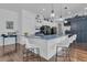 Spacious kitchen with a large island, stainless steel appliances, and elegant hardwood floors at 599 Glendevon Dr, New Smyrna Beach, FL 32168