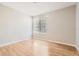 Light-filled bedroom with hardwood floors and a window, creating a serene and inviting space at 6340 Raleigh St # 1002, Orlando, FL 32835