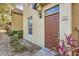 Charming townhome featuring a well-maintained front yard and a warm, inviting entrance at 6340 Raleigh St # 1002, Orlando, FL 32835