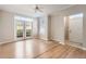 Bright living room boasts French doors and a large window allowing natural light at 6340 Raleigh St # 1002, Orlando, FL 32835