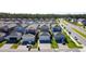 Aerial view of a well-planned community, showcasing modern homes and manicured landscaping at 6404 Pine Fork Aly, St Cloud, FL 34771