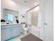 Clean bathroom with modern fixtures, featuring a shower-tub combo and neutral color scheme at 6404 Pine Fork Aly, St Cloud, FL 34771