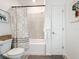 Clean bathroom with modern fixtures, featuring a shower-tub combo and neutral color scheme at 6404 Pine Fork Aly, St Cloud, FL 34771