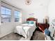 Well-lit bedroom with stylish decor, featuring a cozy bed and elegant wooden furniture at 6404 Pine Fork Aly, St Cloud, FL 34771