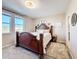 Comfortable bedroom featuring a decorative bed, plush carpet, and natural lighting at 6404 Pine Fork Aly, St Cloud, FL 34771