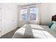 Bright bedroom with natural light and a comfortable bed, creating a cozy atmosphere at 6404 Pine Fork Aly, St Cloud, FL 34771