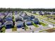 A vibrant community featuring a mix of modern homes with attached garages and well-manicured lawns at 6404 Pine Fork Aly, St Cloud, FL 34771