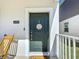 Welcoming front entrance with a stylish door and cozy doormat, creating a charming first impression at 6404 Pine Fork Aly, St Cloud, FL 34771