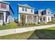 Inviting home featuring a cozy front porch, manicured lawn, and a sidewalk in a residential neighborhood at 6404 Pine Fork Aly, St Cloud, FL 34771