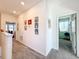 Upstairs hallway features carpet and several rooms branching off it at 6404 Pine Fork Aly, St Cloud, FL 34771