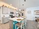 Spacious kitchen featuring a large island with seating, modern appliances, and ample counter space at 6404 Pine Fork Aly, St Cloud, FL 34771