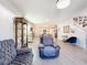 Comfortable living room with sofas, cabinet, and open access to the dining and kitchen areas at 6404 Pine Fork Aly, St Cloud, FL 34771