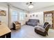 Cozy living room with large windows and comfortable furniture at 6404 Pine Fork Aly, St Cloud, FL 34771
