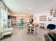 Open-concept living space with dining area, modern kitchen and staircase at 6404 Pine Fork Aly, St Cloud, FL 34771