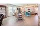 Bright and airy living space with modern finishes, dining area, and kitchen view at 6404 Pine Fork Aly, St Cloud, FL 34771