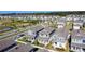 Desirable neighborhood showcasing homes with charming front porches and landscaped gardens, ideal for suburban living at 6404 Pine Fork Aly, St Cloud, FL 34771