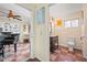 Hallway that provides access to sunroom and bathroom, showing floor tile and interior paint at 7025 Big Bend Dr, St Cloud, FL 34771