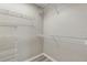 Walk-in closet equipped with multiple shelving units and laminate flooring at 735 Deerfoot Rd, Deland, FL 32720