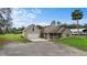 Lovely home with an attached garage, a cozy front porch, and a well-maintained lawn at 735 Deerfoot Rd, Deland, FL 32720