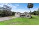 Lovely home with an attached garage, a cozy front porch, and a well-maintained lawn at 735 Deerfoot Rd, Deland, FL 32720