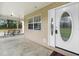 Covered front porch with an outdoor swing and a view of the front door at 735 Deerfoot Rd, Deland, FL 32720