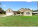 Charming single-Gathering home with a welcoming front porch and well-manicured lawn at 735 Deerfoot Rd, Deland, FL 32720