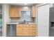 Bright kitchen with stainless appliances, stone countertops, and light wood cabinets at 735 Deerfoot Rd, Deland, FL 32720