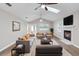 Stylishly furnished living room featuring a cozy fireplace, a plush sofa, and modern decor accents at 735 Deerfoot Rd, Deland, FL 32720