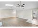 Spacious living room with vaulted ceilings and sleek, light-colored wood flooring at 735 Deerfoot Rd, Deland, FL 32720