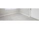 A room shows neutral tile floor, white walls with white door and trim at 735 Deerfoot Rd, Deland, FL 32720