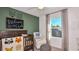 Stylized Bedroom with wood crib, rocking chair, and adorable woodland creature decorations creating a warm atmosphere at 7351 Capstone Dr, Groveland, FL 34736