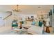 Spacious living room with modern decor, a neutral color palette, and lots of natural light at 7351 Capstone Dr, Groveland, FL 34736