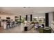 Bright, open-concept living space with a modern kitchen, dining area, and comfortable living room at 7355 Capstone Dr, Groveland, FL 34736